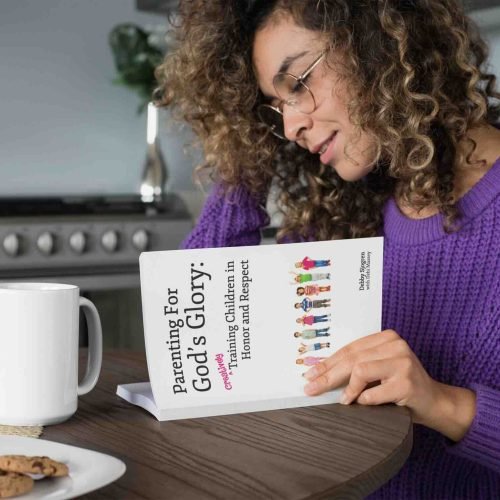 mug-and-book-mockup-featuring-a-woman-reading-in-the-kitchen-28470